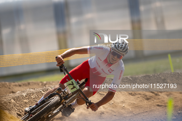 Filip Polchlopek of Poland competes in the UCI Mountain Bike World Championships Cross-Country Olympic Men Junior in Pal Arinsal, Andorra, o...