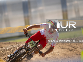 Filip Polchlopek of Poland competes in the UCI Mountain Bike World Championships Cross-Country Olympic Men Junior in Pal Arinsal, Andorra, o...