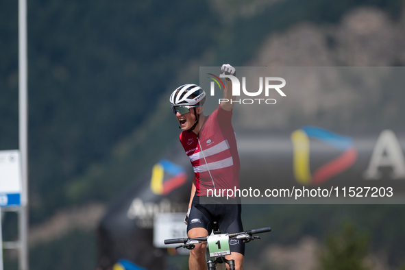 Albert Philipsen of Denmark wins the final race in the UCI Mountain Bike World Championships Cross-Country Olympic Men Junior in Pal Arinsal...