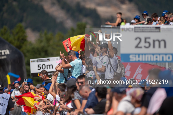 Spanish fans celebrate third place in the UCI Mountain Bike World Championships Cross-Country Olympic Men Junior in Pal Arinsal, Andorra, on...