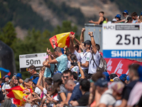 Spanish fans celebrate third place in the UCI Mountain Bike World Championships Cross-Country Olympic Men Junior in Pal Arinsal, Andorra, on...