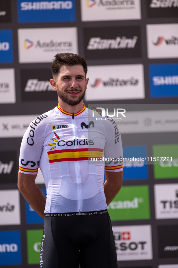 Nicolas Franco of Spain celebrates on the podium for third place in the UCI Mountain Bike World Championships Cross-Country Olympic Men Juni...