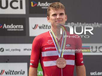 Henrique Hougs of Denmark celebrates on the podium for third place in the UCI Mountain Bike World Championships Cross-Country Olympic Men Ju...