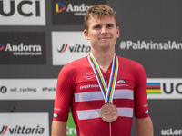 Henrique Hougs of Denmark celebrates on the podium for third place in the UCI Mountain Bike World Championships Cross-Country Olympic Men Ju...