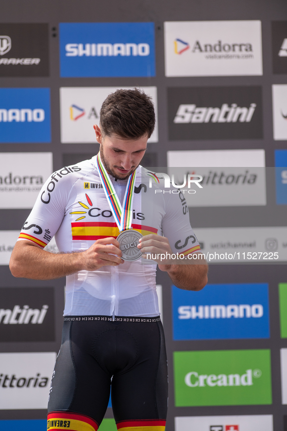 Nicolas Franco of Spain celebrates on the podium for third place in the UCI Mountain Bike World Championships Cross-Country Olympic Men Juni...