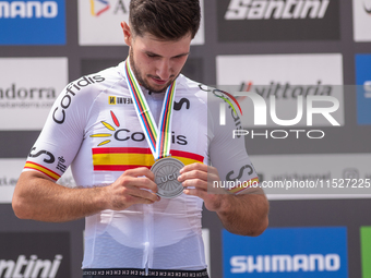 Nicolas Franco of Spain celebrates on the podium for third place in the UCI Mountain Bike World Championships Cross-Country Olympic Men Juni...