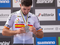 Nicolas Franco of Spain celebrates on the podium for third place in the UCI Mountain Bike World Championships Cross-Country Olympic Men Juni...