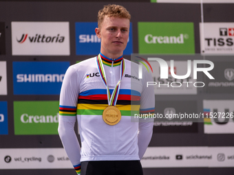 In Pal Arinsal, Andorra, on August 30, 2024, Nicolas Philipsen of Denmark celebrates on the podium for third place in the UCI Mountain Bike...