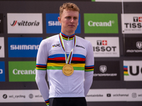 In Pal Arinsal, Andorra, on August 30, 2024, Nicolas Philipsen of Denmark celebrates on the podium for third place in the UCI Mountain Bike...