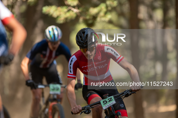 Tristan Barret of Alfred competes in the UCI Mountain Bike World Championships Cross-Country Olympic Men Junior in Pal Arinsal, Andorra, on...