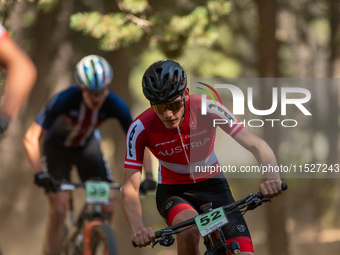 Tristan Barret of Alfred competes in the UCI Mountain Bike World Championships Cross-Country Olympic Men Junior in Pal Arinsal, Andorra, on...