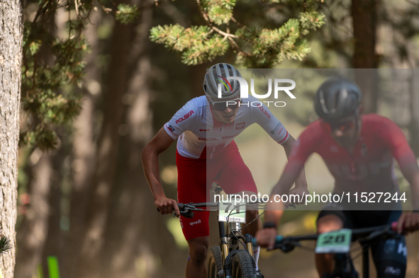 Filip Polchlopek of Poland competes in the UCI Mountain Bike World Championships Cross-Country Olympic Men Junior in Pal Arinsal, Andorra, o...