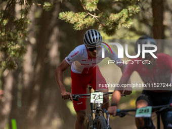 Filip Polchlopek of Poland competes in the UCI Mountain Bike World Championships Cross-Country Olympic Men Junior in Pal Arinsal, Andorra, o...