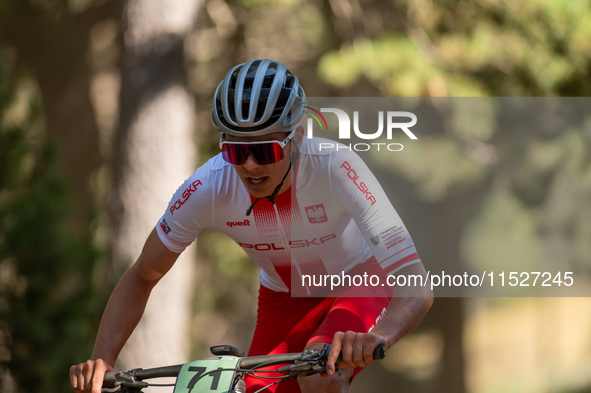 Filip Polchlopek of Poland competes in the UCI Mountain Bike World Championships Cross-Country Olympic Men Junior in Pal Arinsal, Andorra, o...