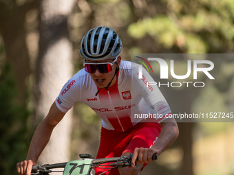 Filip Polchlopek of Poland competes in the UCI Mountain Bike World Championships Cross-Country Olympic Men Junior in Pal Arinsal, Andorra, o...