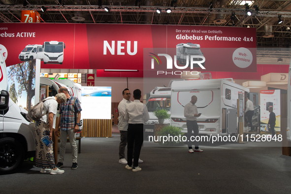 Visitors check the Dethleffs camping vans at the Duesseldorf Trade Fair Center during the Caravan Salon, the leading motorhome and camping v...