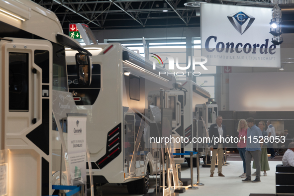 Visitors check the Concorde motorhome at the Duesseldorf Trade Fair Center during the Caravan Salon, the leading motorhome and camping van t...