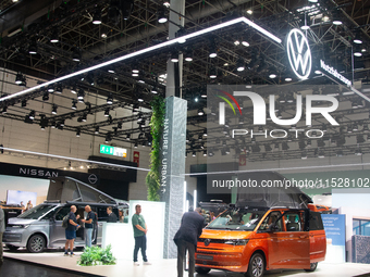 Visitors check Volkswagen camping vans at the Duesseldorf Trade Fair Center during the Caravan Salon, the leading motorhome and camping van...