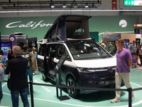 Visitors check Volkswagen camping vans at the Duesseldorf Trade Fair Center during the Caravan Salon, the leading motorhome and camping van...