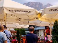 People rest in a bar on a landmark Krupowki Street in the center of Zakopane, a popular Tatra mountain holiday resort on the last weekend of...