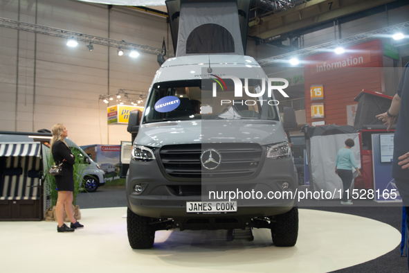 Visitors check Westfalia camping vans at the Duesseldorf Trade Fair Center during the Caravan Salon, the leading motorhome and camping van t...