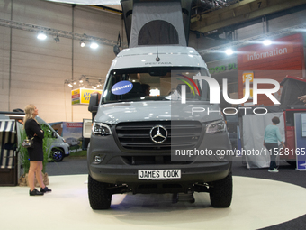 Visitors check Westfalia camping vans at the Duesseldorf Trade Fair Center during the Caravan Salon, the leading motorhome and camping van t...