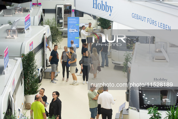 Visitors check Hobby camping vans at the Duesseldorf Trade Fair Center during the Caravan Salon, the leading motorhome and camping van trade...