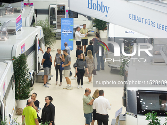 Visitors check Hobby camping vans at the Duesseldorf Trade Fair Center during the Caravan Salon, the leading motorhome and camping van trade...