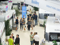 Visitors check Hobby camping vans at the Duesseldorf Trade Fair Center during the Caravan Salon, the leading motorhome and camping van trade...