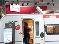 A visitor checks the Dethleffs camping van at the Duesseldorf Trade Fair Center during the Caravan Salon, the leading motorhome and camping...