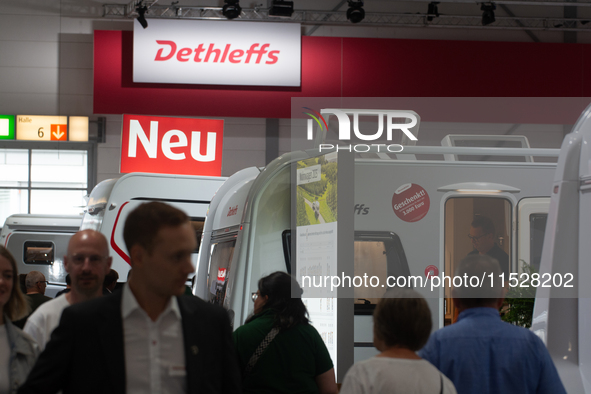 Visitors check Dethleffs camping vans at the Duesseldorf Trade Fair Center during the Caravan Salon, the leading motorhome and camping van t...