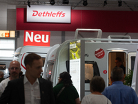 Visitors check Dethleffs camping vans at the Duesseldorf Trade Fair Center during the Caravan Salon, the leading motorhome and camping van t...