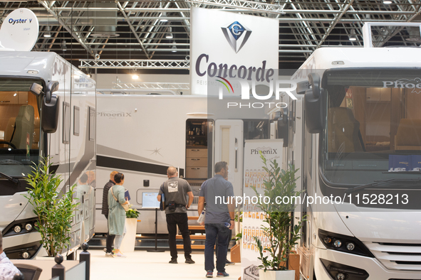 Visitors check the Concorde motorhome at the Duesseldorf Trade Fair Center during the Caravan Salon, the leading motorhome and camping van t...