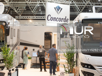 Visitors check the Concorde motorhome at the Duesseldorf Trade Fair Center during the Caravan Salon, the leading motorhome and camping van t...