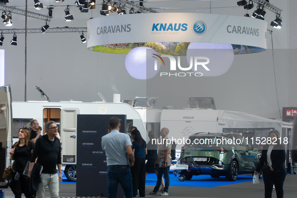 Visitors check Knaus camping vans at the Dusseldorf Trade Fair Center during the Caravan Salon, the leading motorhome and camping van trade...