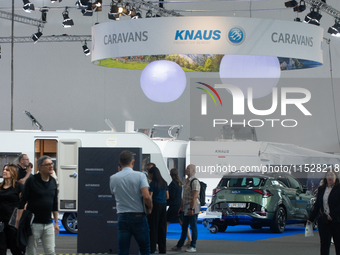 Visitors check Knaus camping vans at the Dusseldorf Trade Fair Center during the Caravan Salon, the leading motorhome and camping van trade...