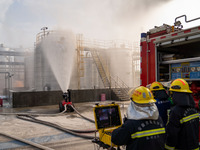 Firefighters fight a fire at the site of an emergency drill for hazardous chemicals production in a chemical park in Hefei, China, on August...