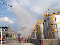 Firefighters fight a fire at the site of an emergency drill for hazardous chemicals production in a chemical park in Hefei, China, on August...