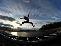 A little girl, Minudi Menulya, jumps on a trampoline in Twizel, New Zealand, on August 30, 2024. (