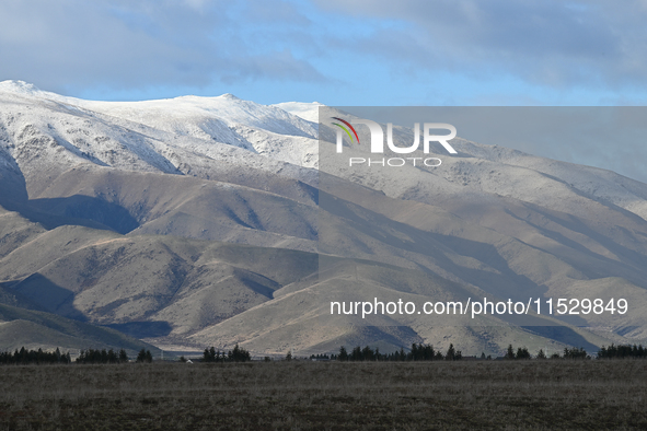 A general view of snow-covered mountains in Twizel, New Zealand, on August 30, 2024. 