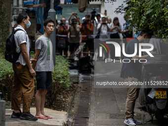 A man arrested by the National Security Police is seen during a police evidence gathering operation in Hong Kong, China, on August 31, 2024....