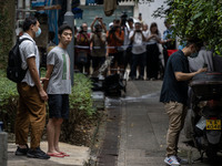 A man arrested by the National Security Police is seen during a police evidence gathering operation in Hong Kong, China, on August 31, 2024....