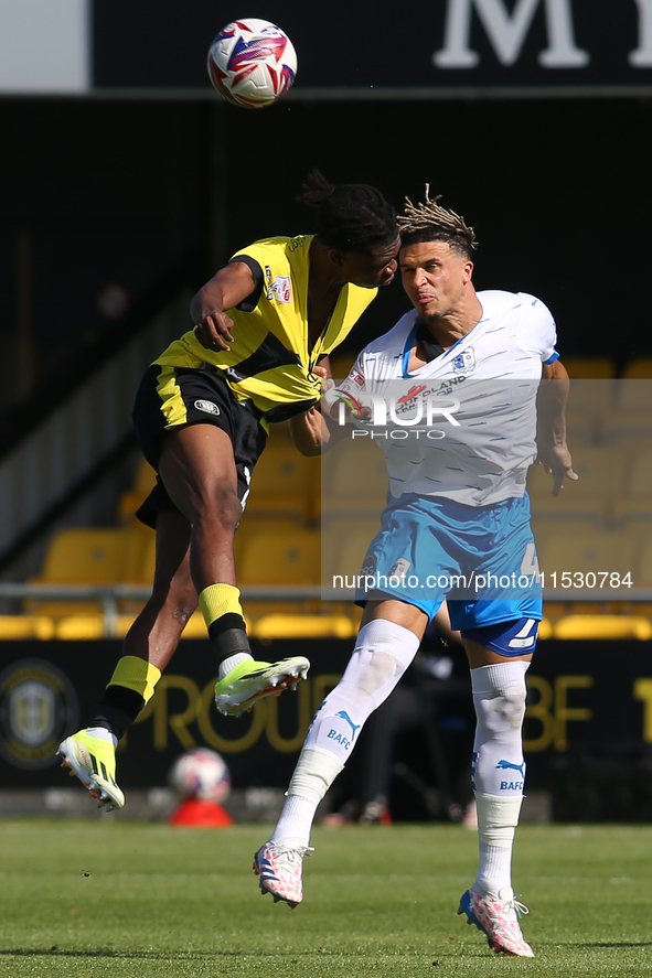 Theo Vassell of Barrow wins a header during the Sky Bet Championship match between  Harrogate and Barrow, in Harrogate, United Kingdom, on A...