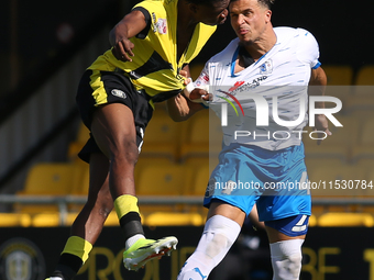 Theo Vassell of Barrow wins a header during the Sky Bet Championship match between  Harrogate and Barrow, in Harrogate, United Kingdom, on A...