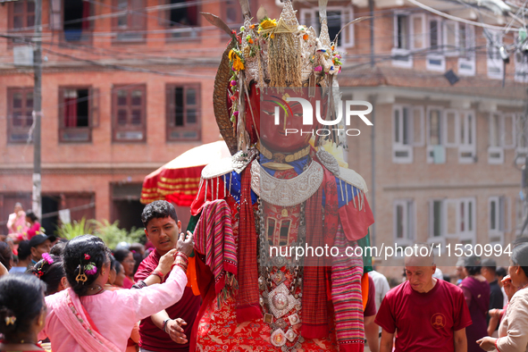 Nepali devotees carry the statues of Dipankar Buddha during the Panchadan festival in Bhaktapur, Nepal, on August 31, 2024. On this day, Bud...