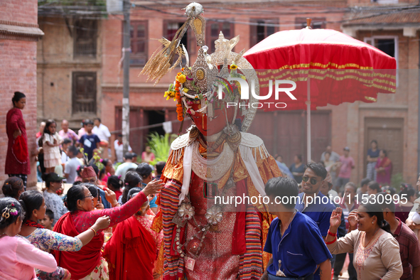 Nepali devotees worship the statues of Dipankar Buddha during the Panchadan festival in Bhaktapur, Nepal, on August 31, 2024. On this day, B...