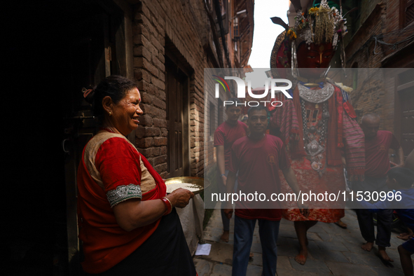 A Nepali devotee worships the statues of Dipankar Buddha during the Panchadan festival in Bhaktapur, Nepal, on August 31, 2024. On this day,...