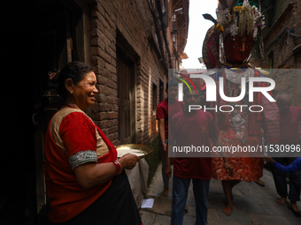 A Nepali devotee worships the statues of Dipankar Buddha during the Panchadan festival in Bhaktapur, Nepal, on August 31, 2024. On this day,...