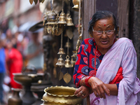 An elderly Nepali citizen watch the parade of statues of Dipankar Buddha during the Panchadan festival in Bhaktapur, Nepal on 31 August, 202...