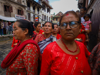 Nepali devotees watch the parade of statues of Dipankar Buddha during the Panchadan festival in Bhaktapur, Nepal, on August 31, 2024. On thi...